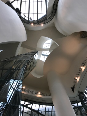 Inside Guggenheim Museum Bilbao by Frank Gehry, looking up. When you look down from the top floor nothing is straight. What a nightmare for the plasterers. And it can make you feel dizzy.